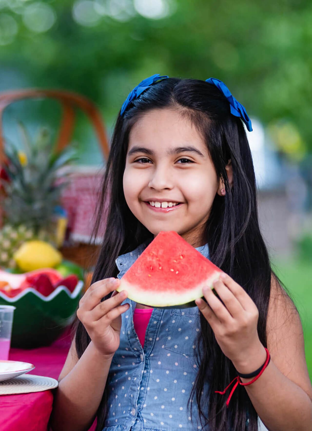 About Girl enjoying Kids Choice Watermelon slice